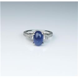 18CAI-66 SAPPHIRE & DIAMOND RINGElegant ring featuring a vivid blue cabochon  Sapphire weighing 2.97