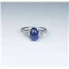 Image 1 : 18CAI-66 SAPPHIRE & DIAMOND RINGElegant ring featuring a vivid blue cabochon  Sapphire weighing 2.97