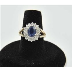 18PRS-10 SAPPHIRE & DIAMOND RINGOne 14k white gold ladies ring set with an  oval sapphire weighing a