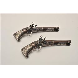 EVE-80 PAIR OF MIQUELET PISTOLSSuperb pair of ornately silver mounted  miquelet pistols in Spanish R