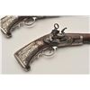 Image 6 : EVE-80 PAIR OF MIQUELET PISTOLSSuperb pair of ornately silver mounted  miquelet pistols in Spanish R