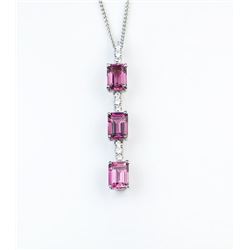 18CAI-4 PINK TOURMALINE & DIAMOND PENDANTGorgeous pendant set with three matching Pink  Tourmalines 