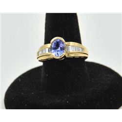 18PRS-17 TANZANITE & DIAMOND RINGOne ladies ring in 14k yellow gold set with a  oval tanzanite appro