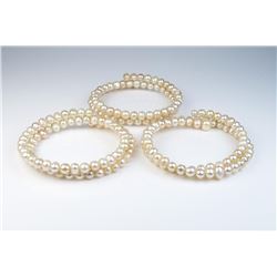 18CAI-62 BANGLE BRACELETNice lot of three Freshwater Pearl bangle  bracelets of a peach cream color 