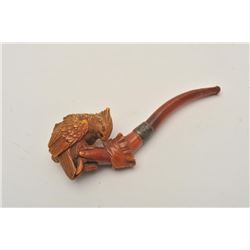 EVE-400 CARVED MEERSHAM PIPECarved 19th century meersham pipe of bird on  hand with amber stem. Meas
