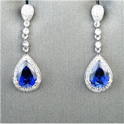 18CAI-30 SAPPHIRE & DIAMOND EARRINGSElegant dangle earrings featuring two pear  shape lab created Sa