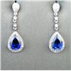 Image 1 : 18CAI-30 SAPPHIRE & DIAMOND EARRINGSElegant dangle earrings featuring two pear  shape lab created Sa