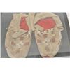 Image 1 : 18AP-69 BEADED MOCSPair of Indian beaded moccasins in riker  case; cross designs.      Est.:  $100-$