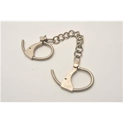 18AP-80 LEG IRONSTower Double Lock leg irons.  The lot  includes one set of stainless, Tower marked 