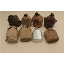 17JL-18 CANTEEN LOTLot of 8 U.S. military canteens, 7 with  covers; mostly Korean War era.      Est.