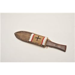 18AP-50 DAG WITH SCABBARD20th Century Indian dagger with wood grip and  accompanied by a beaded and 