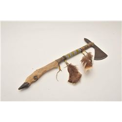 18AP-61 TOMAHAWKTomahawk with beaded shaft and deer foot  bottom portion of grip; approximately 21.5