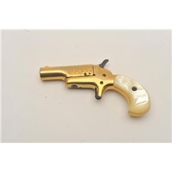 18BT-4 COLT 22 DERRINGERColt .22 derringer with gold finish and pearl  grips. NSNV. Lock broken. 80%