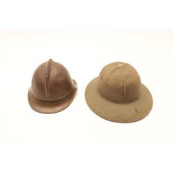18BF-7 2-HELMETSUSN marked tropical pith helmet and brass  French Fireman type helmet.  The pith hel