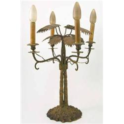 An Empire design gilt brass table lamp, with four branches and foliate branches supported upon tw...