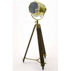 An early 20th century brass search light, on brass mounted stained pine adjustable tripod, 10 ins...