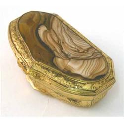An 18th century Continental gilt brass snuff box, with inset marble hinged lid and foliate decora...