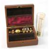 Image 1 : A mahogany cased field hydrometer, with ivory backed thermometer, hydrometer stem, nine weights,...