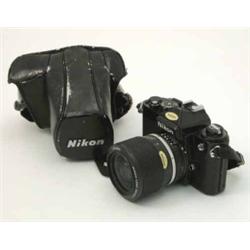 A Nikon FE 3106116 camera, with leather case...