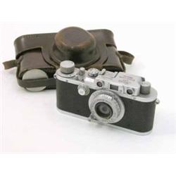 A Leica D.R.P Ernst Leitz Wetzlar camera, with leather case, No 340390, 5.25 ins...
