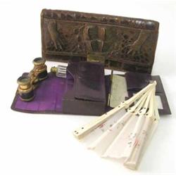 A pair of gilt metal opera glasses with leather case, housing a fan and other accessories and a c...
