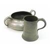 Image 1 : A twin handled shallow pewter bowl, and a pewter tankard with scroll handle, touch marks to both,...