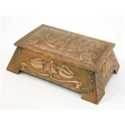 An Art Nouveau hammered copper cigar box, decorated throughout with repousse foliate motifs and r...