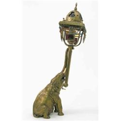 A Bergmann bronze elephant table lamp, the Eastern style lantern with dome top and hung with colo...