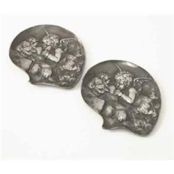 A small pair of pewter dishes, each embossed with a classical female figure and a putto, 4.5 ins...