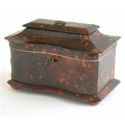 A Regency two division tortoiseshell tea caddy, with pagoda lid and serpentine front on bun feet,...