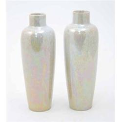 A pair of Ruskin vases, slender tapering form with collar rim, pale pink and yellow iridescent gl...