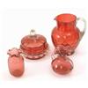 Image 1 : A Victorian cranberry glass jug, with patterned body and clear glass reeded handle, a cranberry g...