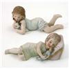Image 1 : A pair of piano babies, one clutching a rabbit, impressed number 7480, 8ins and another lying on...