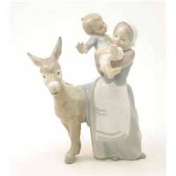 A Lladro group of a mother and child with a donkey, 10.5ins...
