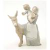 Image 1 : A Lladro group of a mother and child with a donkey, 10.5ins...