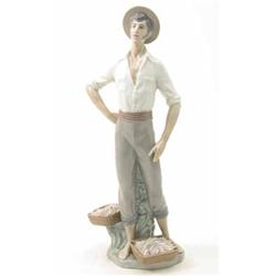 A Lladro figure of fisherman, 15ins...