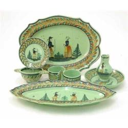 A Quimper pottery 'Breton' pattern 41 piece dinner service, including three oval dishes, various...