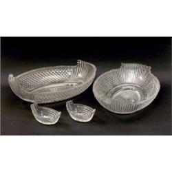 A pair of late 19th century cut glass oval dishes and salts, with deep cut decoration and star cu...