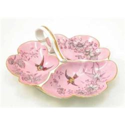 A late 19th century biscuit, cheese and butter dish, with three compartments and scroll leaf hand...