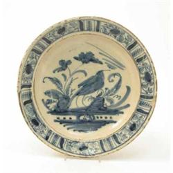 A late 18th century Continental tin glazed earthenware bowl, decorated in underglaze blue with a...