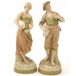 A pair of Royal Dux figures of labourers carrying water pitchers, 17 ins....
