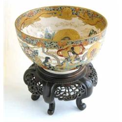 A late 19th century Satsuma bowl, enamelled and gilded with a dragon and seated figures, Satsuma...