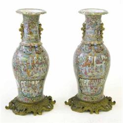 A pair of 19th century Cantonese baluster vases, applied with salamanders and profusely decorated...