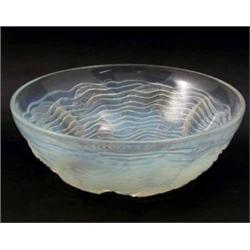 A Lalique opalescent glass Dauphins bowl, pre-war, a concentric design of fish and waves, engrave...
