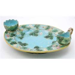 A George Jones majolica strawberry dish, oval and moulded with strawberries and leaves, complete...