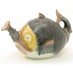 A late 19th century Continental majolica novelty teapot, in the form of a fish, moulded scale-eff...