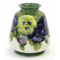 A Moorcroft Macintyre Pansy vase, circa 1912, decorated with an encircling band in shades of blue...