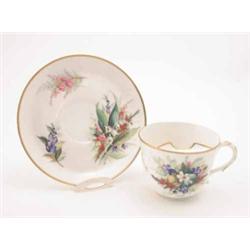 A Victorian Royal Worcester moustache cup and saucer, right-handed, painted with flower sprays an...