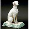 Image 1 : A late Victorian Mintons model of a seated dog, on rectangular base, moulded with scrolls, moulde...