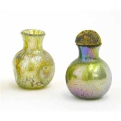 Two miniature Loetz iridescent glass bottles, one with dimpled globular body, the other spherical...